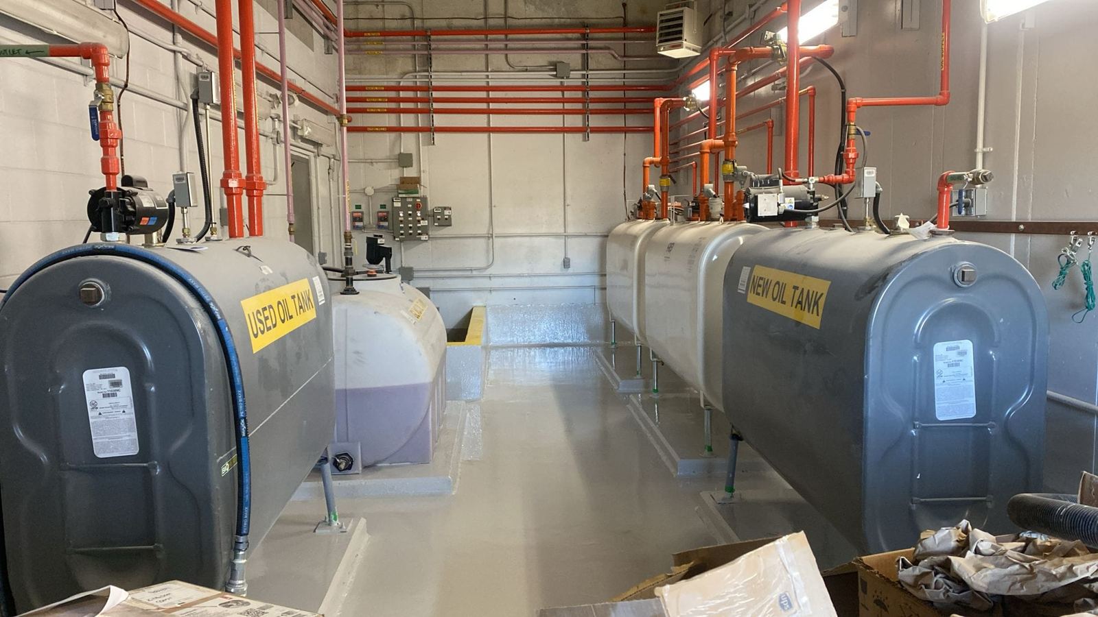Epoxy floor and containment in an oil tank room