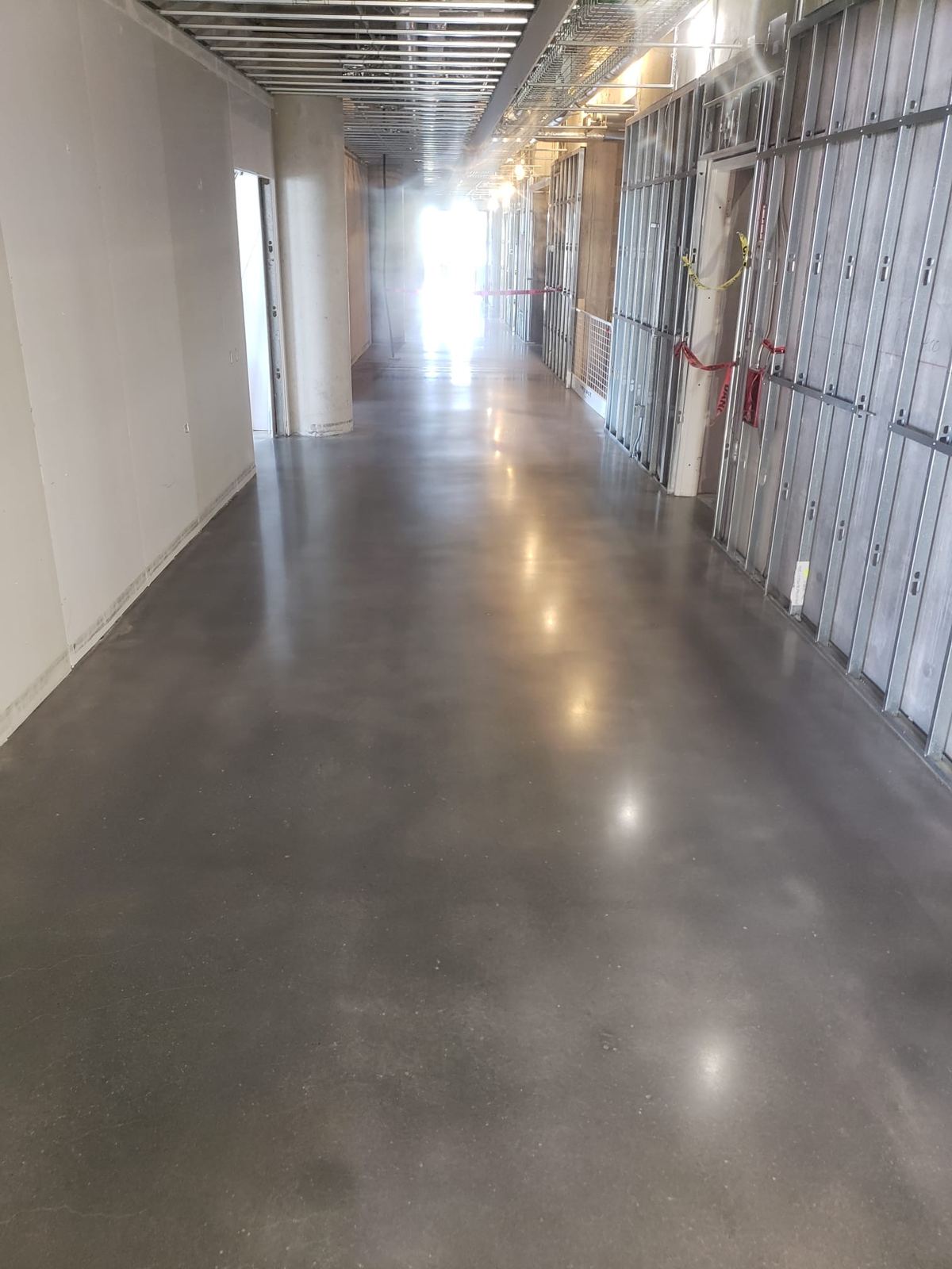 Polished concrete corridor in a building under construction
